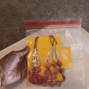 Charming Charlie coral medium length necklace.